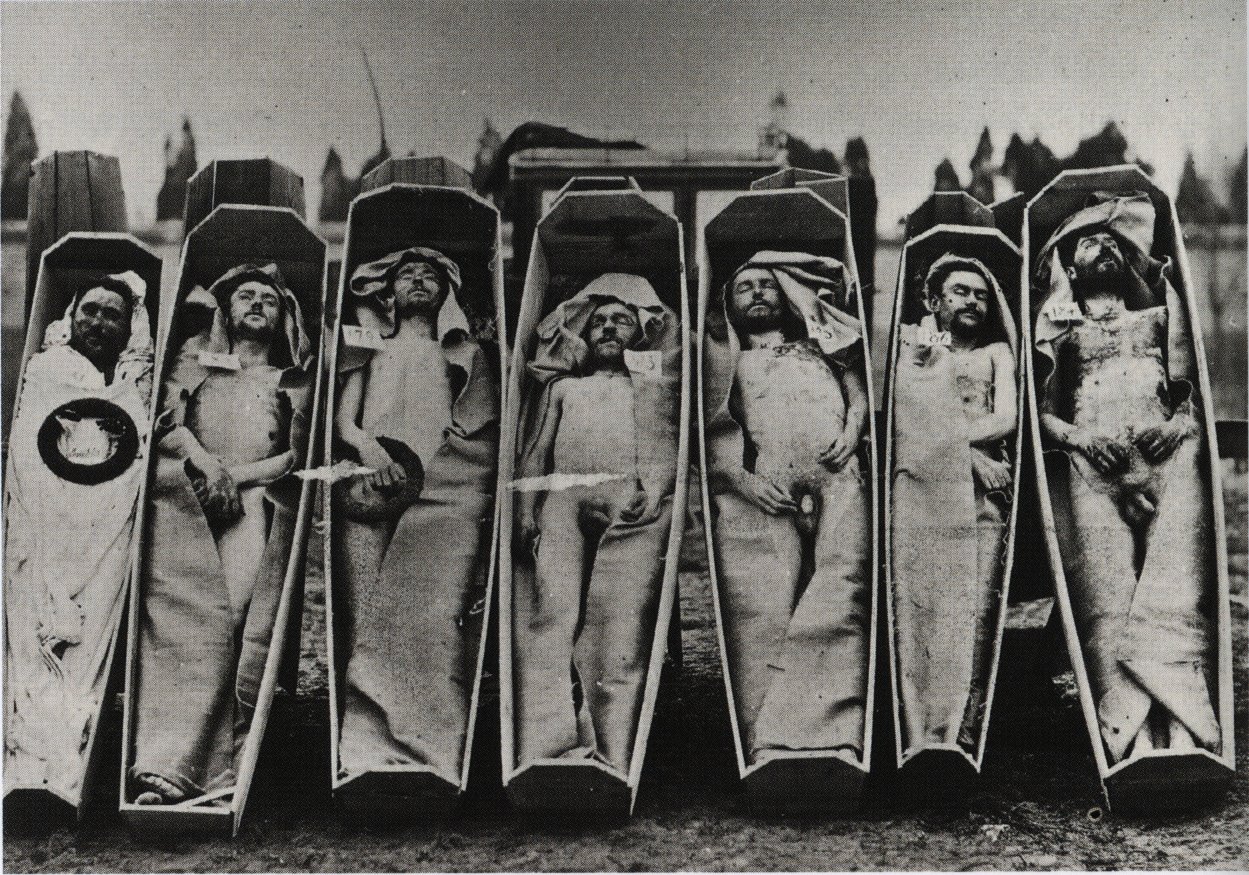 Photo of seven Communards in their coffins, by André-Adolphe-Eugène_Disdéri...